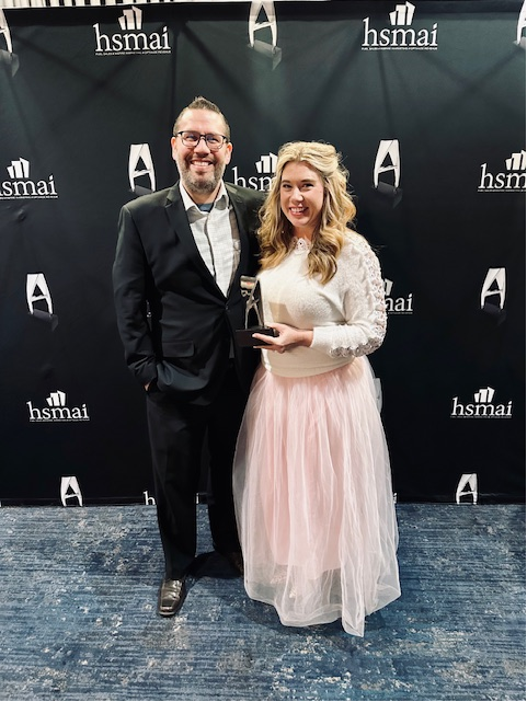 Matt Algarin, tourism director, and Kelli Carter, director of marketing, accept Walton County Tourism’s HSMAI Adrian awards, recognizing excellence in destination marketing and storytelling at the 2024 Adrian Awards celebration in New York City.